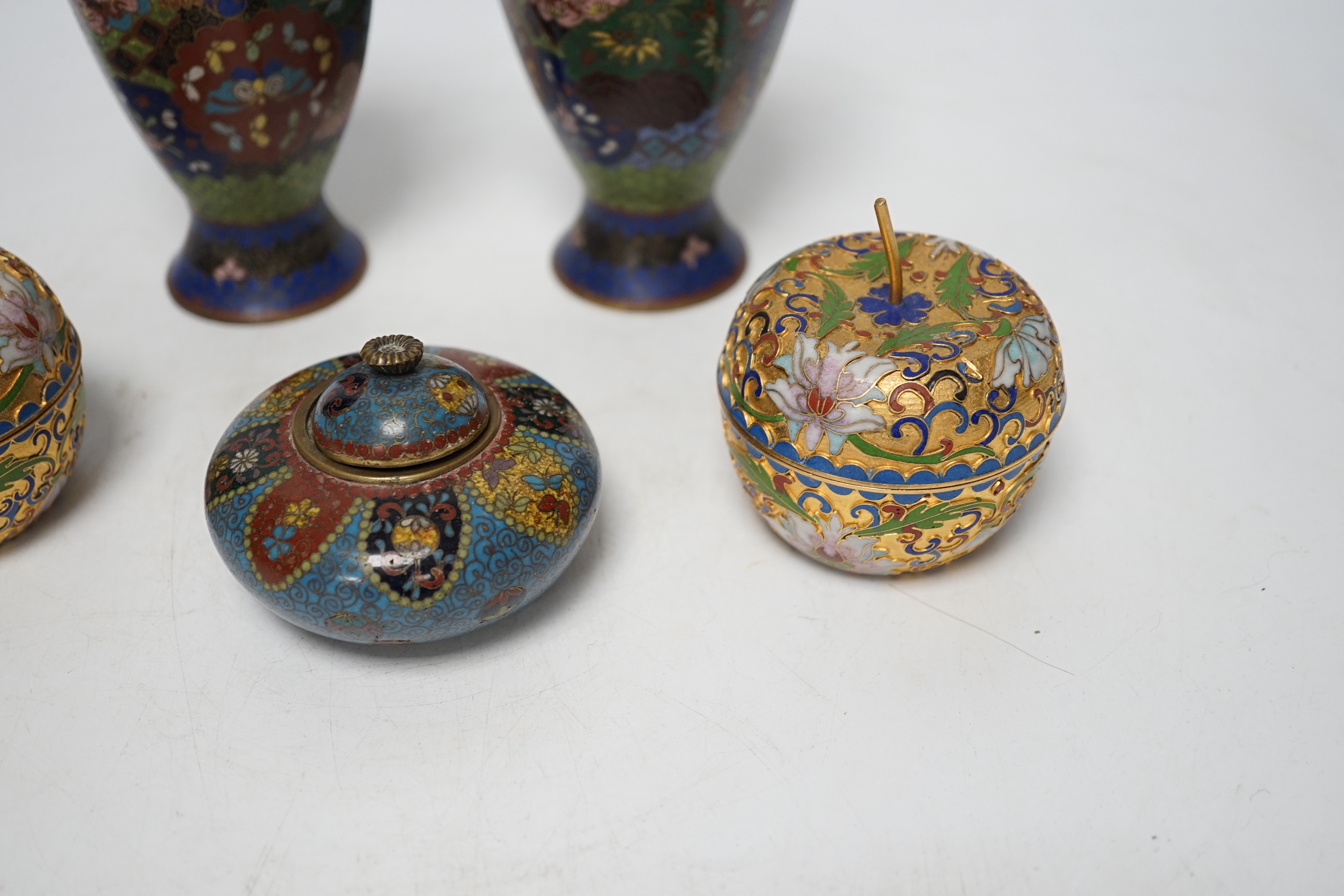 A pair of Chinese cloisonné enamel vases, similar Meiji period Japanese pot and cover and a pair of champleve ‘Apple’ boxes and covers, tallest 15cm